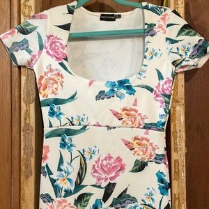 Long fitted dress with a ruffle at the bottom